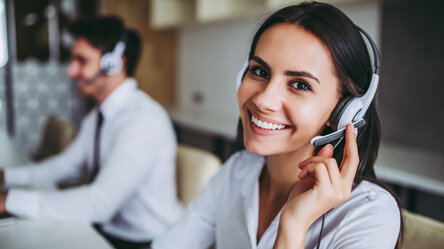 Woman with headset in support office