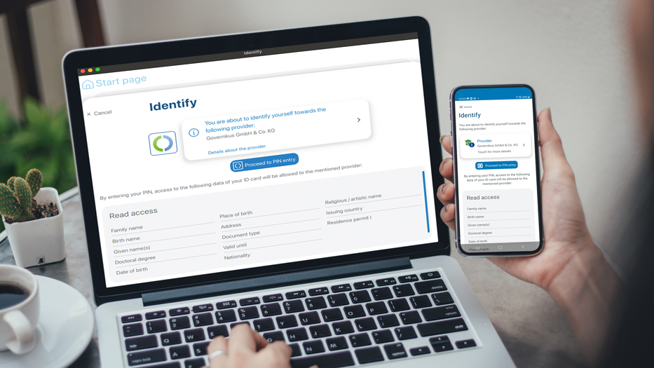 Laptop and smartphone with AusweisApp open at permission request